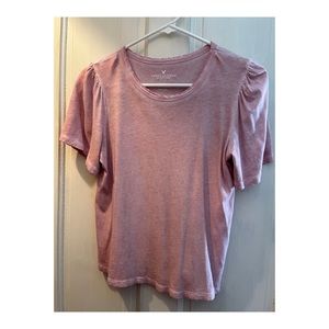 Light pink top with ruffled shoulders